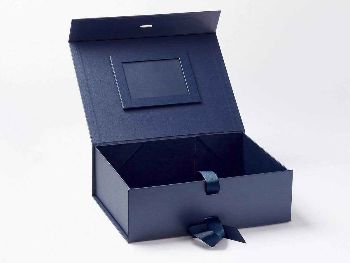 Gift box, paper and foam, blue / silver / white, 1-7/8 x 1-7/8 x 1-3/8 inch  square with ribbon and bow. Sold per pkg of 12. - Fire Mountain Gems and  Beads